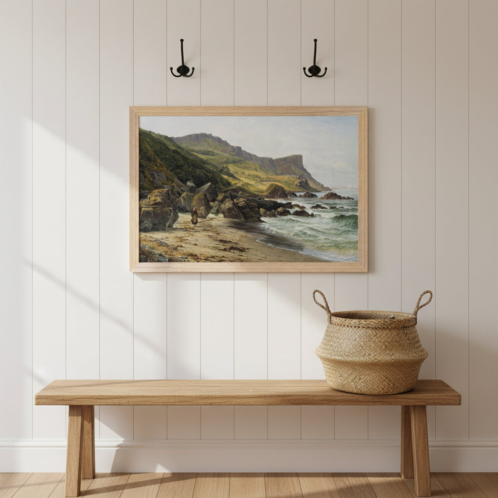 30x45 cm Collector’s Edition Murlough Bay and Fair Head Irish coastline print in natural wood frame on a white panelled hallway wall, wooden bench, woven basket, coat hooks, warm daylight, welcoming Irish heritage home