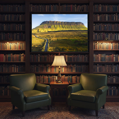 Benbulben framed print in a dark-wood library with green leather armchairs, antique books, and soft lamp lighting, evoking Irish literary tradition.