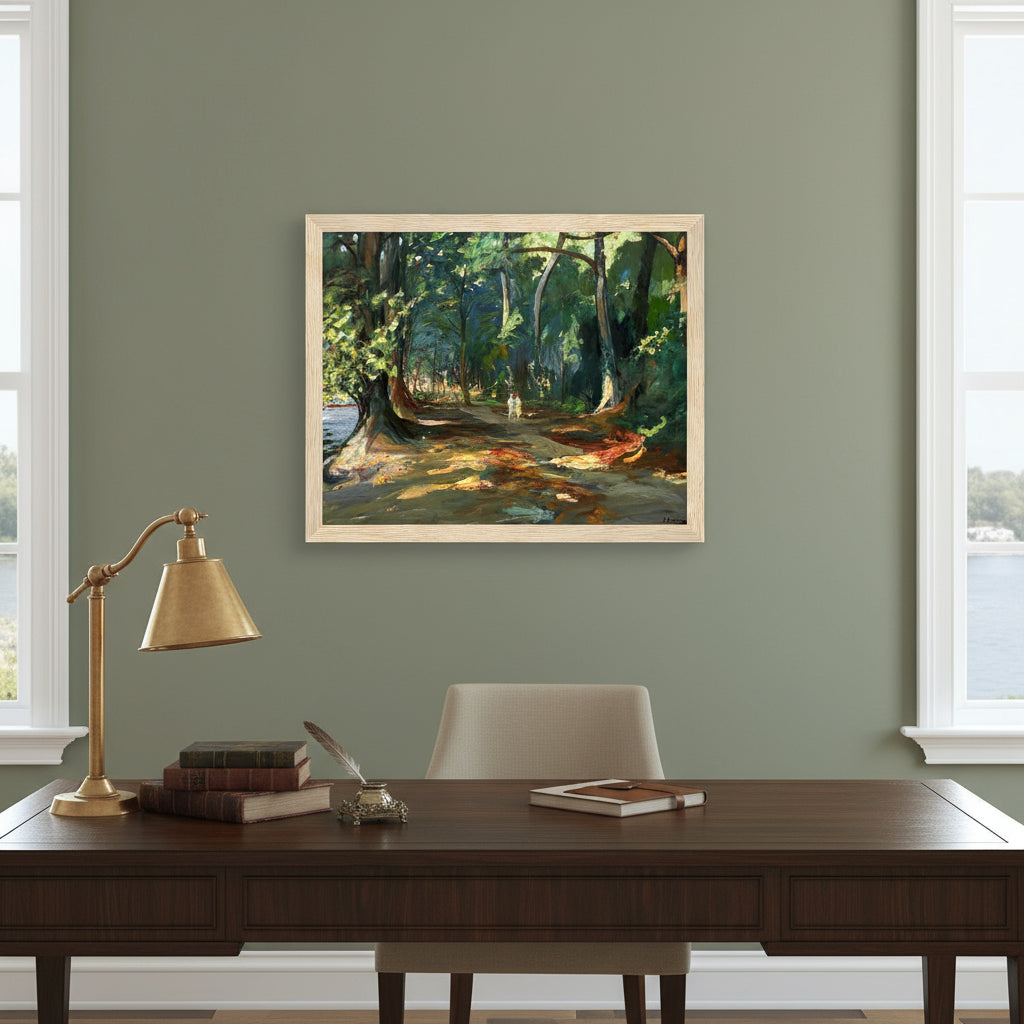 Framed artwork in wood frame above a dark wood writing desk with books, brass lamp and river view ambience.